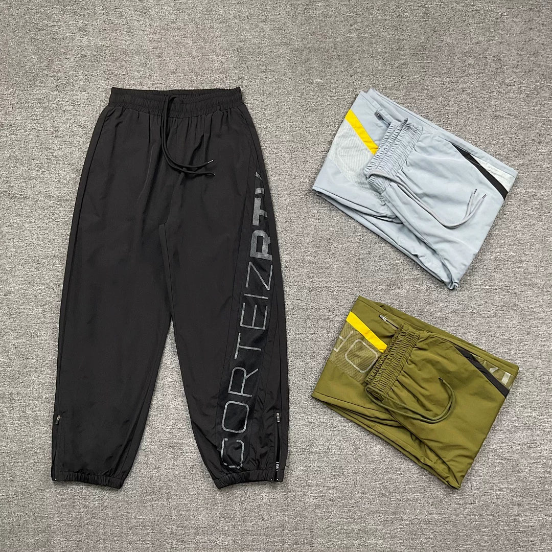 Corteiz trendy high street sports and leisure leggings with patchwork design featuring reflective printed letters and woven pants for men