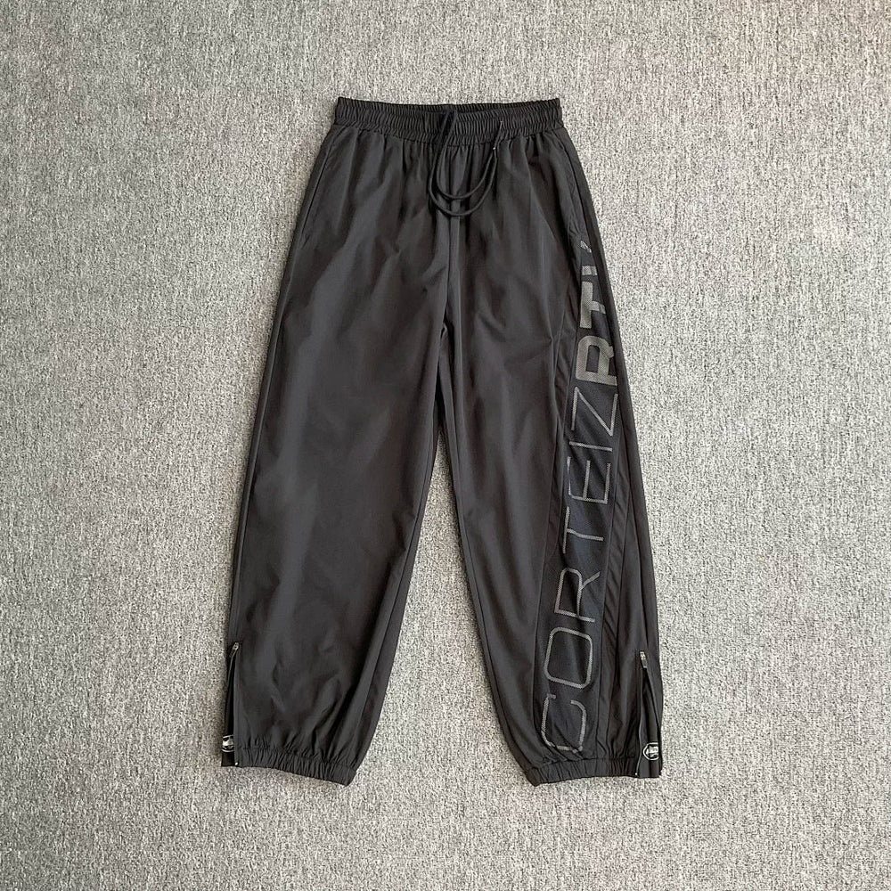 Corteiz trendy high street sports and leisure leggings with patchwork design featuring reflective printed letters and woven pants for men
